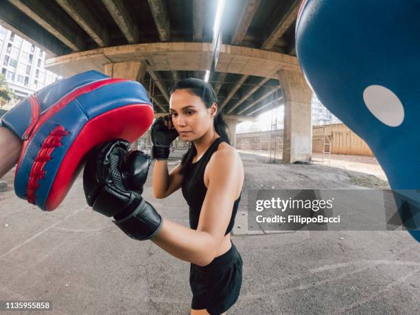 personal perspective of muay thai fighters training together - hand wide angle stock pictures, royalty-free photos & images