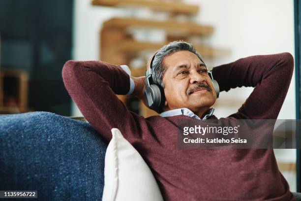 music relaxes me - listening stock pictures, royalty-free photos & images