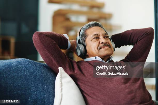 music relaxes me - music relaxation senior stock pictures, royalty-free photos & images