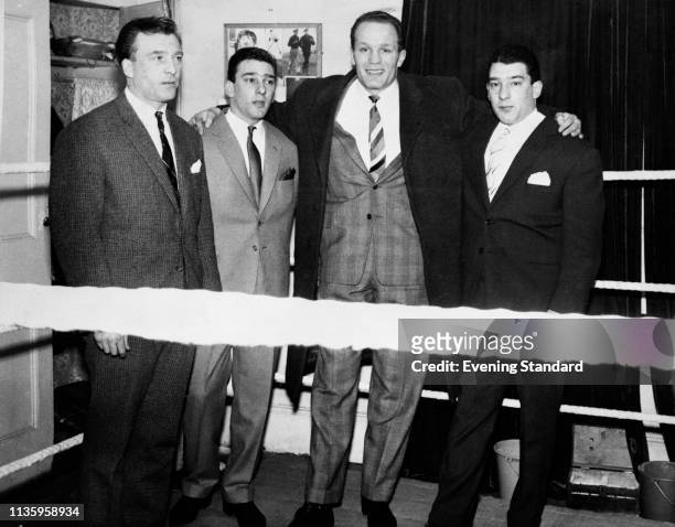 The Kray twins, aka criminals and gangsters Ronald 'Ronnie' Kray and Reginald 'Reggie' Kray , with British heavyweight boxer Henry Cooper , London,...