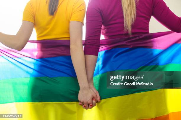 homosexual love - rainbow flag stock pictures, royalty-free photos & images