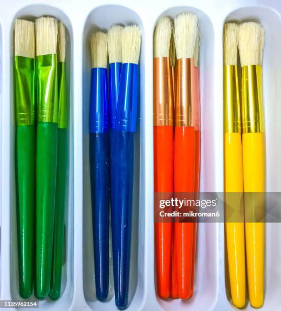 close-up of multi colored paintbrushes - paint tube stock pictures, royalty-free photos & images