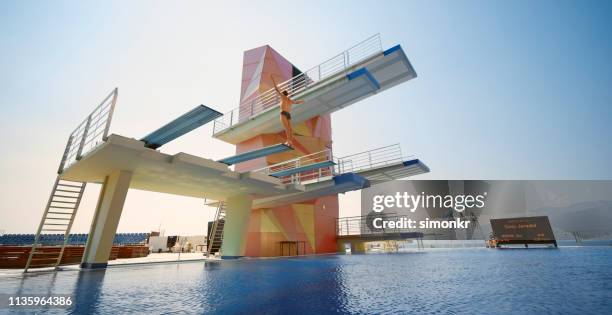 male diver standing on diving board before jump - diving platform stock pictures, royalty-free photos & images