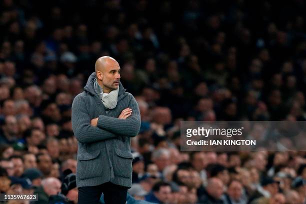 Manchester City's Spanish manager Pep Guardiola reacts during the UEFA Champions League quarter-final first leg football match between Tottenham...