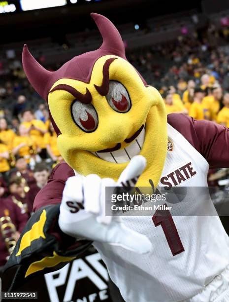 The Arizona State Sun Devils mascot Sparky the Sun Devil poses before a quarterfinal game of the Pac-12 basketball tournament against the UCLA Bruins...