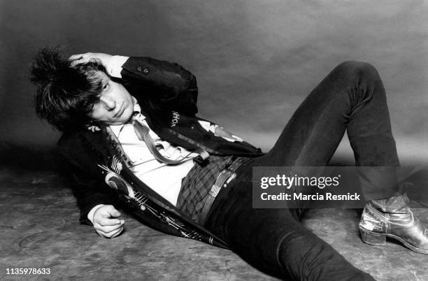 Photo of American Punk musician Johnny Thunders (born John Genzale , of the Heartbreakers, as he reclines on the floor, New York, New York, 1981.