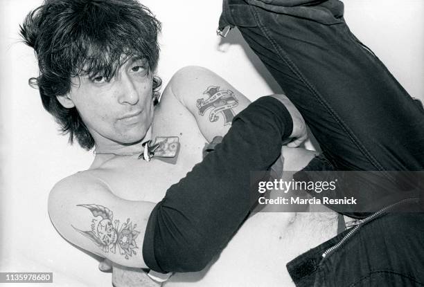 Photo of American Punk musician Johnny Thunders (born John Genzale as he poses, shirtless, in a bathtub at the Gramercy Park Hotel, New York, New...