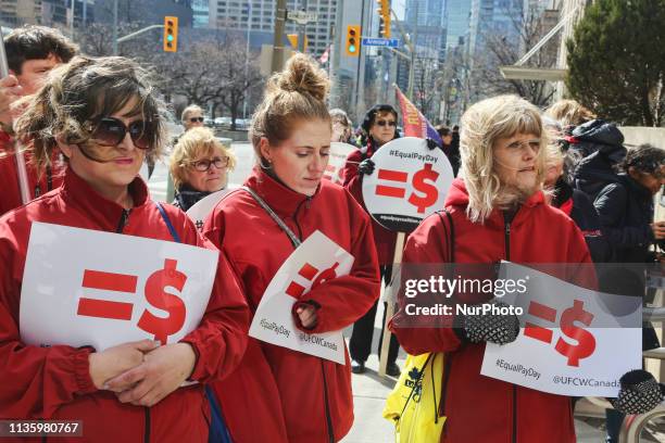 Women rally outside the Ontario Ministry of Labour building to demand equal pay for women and an end to the wage gap between the sexes on 'Equal Pay...