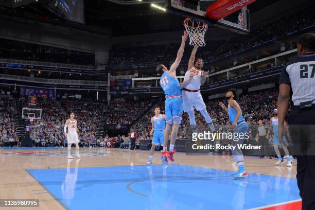 Marquese Chriss of the Cleveland Cavaliers goes up for the shot against Kosta Koufos of the Sacramento Kings on April 4, 2019 at Golden 1 Center in...