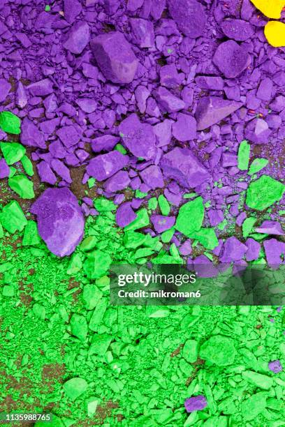 purple and green piles of pigment powder - makeup pile stock pictures, royalty-free photos & images