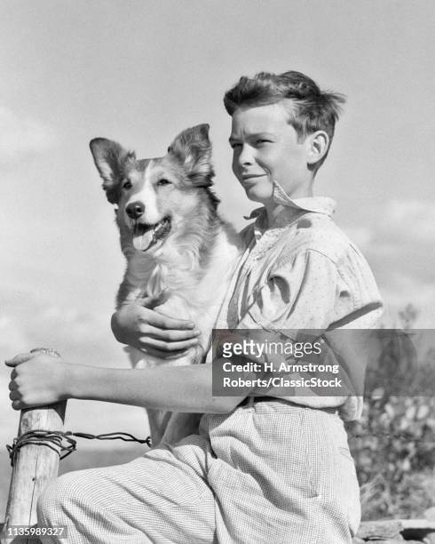 1930s 1940s PORTRAIT BOY SITTING FENCE HOLDING HIS COLLIE DOG PET