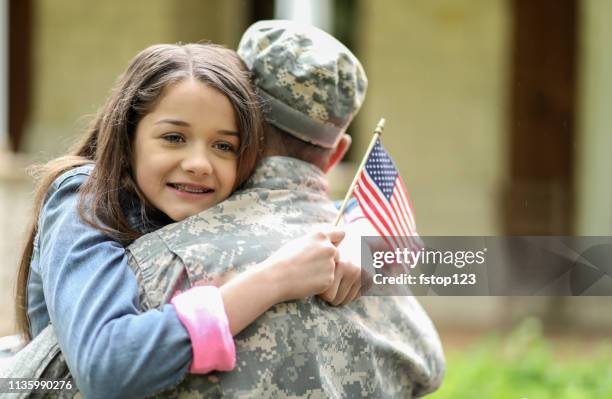 family welcomes home usa army soldier. - happy memorial day stock pictures, royalty-free photos & images