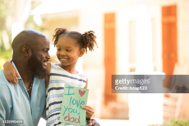 happy father's day. girl gives card to dad. - i love you card stock pictures, royalty-free photos & images