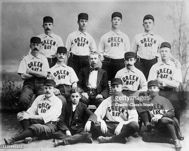 1890s 1891 TURN OF 20th CENTURY GROUP PORTRAIT BASEBALL TEAM PLAYERS WEARING TEAM UNIFORMS LOOKING AT CAMERA GREEN BAY WI USA