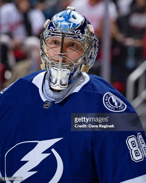 Andrei Vasilevskiy of the Tampa Bay Lightning looks down the ice against the Detroit Red Wings during an NHL game at Little Caesars Arena on March...