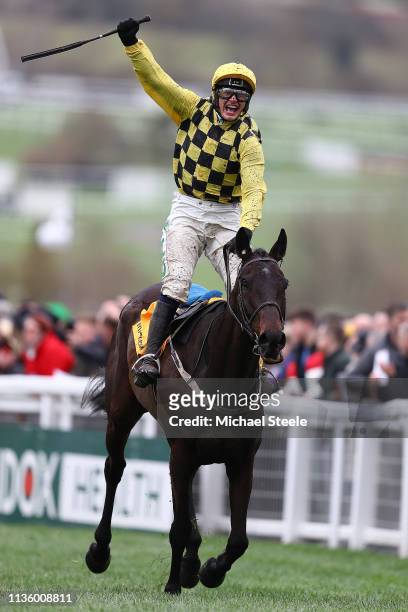 Jockey Paul Townend celebrates with horse Al Boum Photo following their victory in The Magners Cheltenham Gold Cup Steeple Chase on Gold Cup Day at...