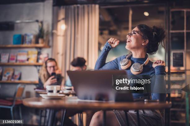 happy student dancing. - headphones in store stock pictures, royalty-free photos & images