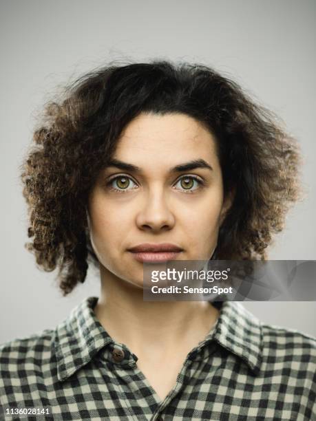 studio portrait of young woman with blank expression - mug shot stock pictures, royalty-free photos & images