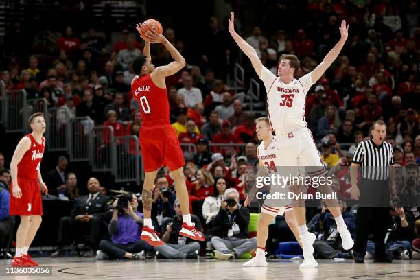 James Palmer Jr. #0 of the Nebraska Huskers attempts a shot while being guarded by Nate Reuvers of the Wisconsin Badgers in the first half during the...