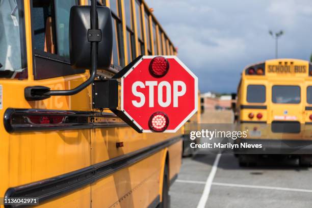 school bus driver doing safety check - scuolabus foto e immagini stock