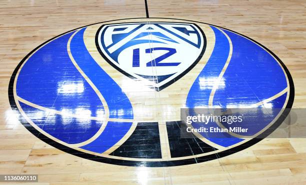 Pac-12 basketball logo is displayed on the court before a semifinal game of the Pac-12 basketball tournament between the Colorado Buffaloes and the...