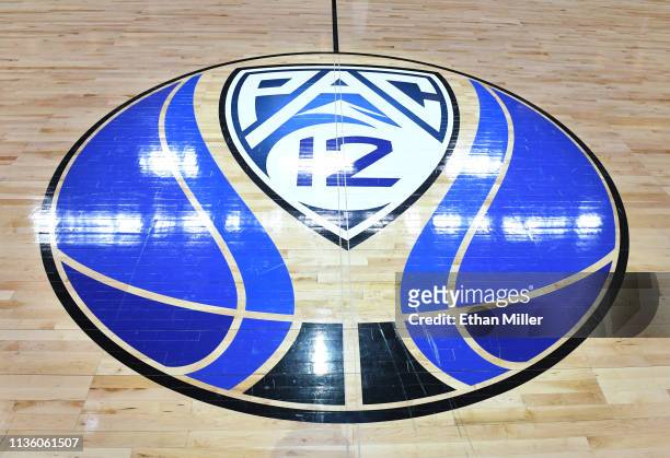 Pac-12 basketball logo is displayed on the court before a semifinal game of the Pac-12 basketball tournament between the Colorado Buffaloes and the...