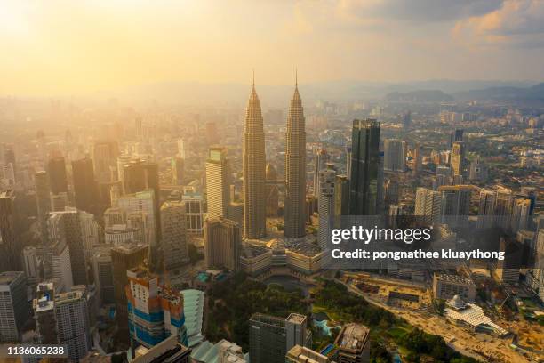 aerial view of kuala lumpur petronas towers. - kuala lumpur aerial view stock pictures, royalty-free photos & images