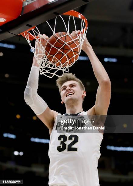 Matt Haarms of the Purdue Boilermakers dunks the ball in the second half against the Minnesota Golden Gophers during the quarterfinals of the Big Ten...