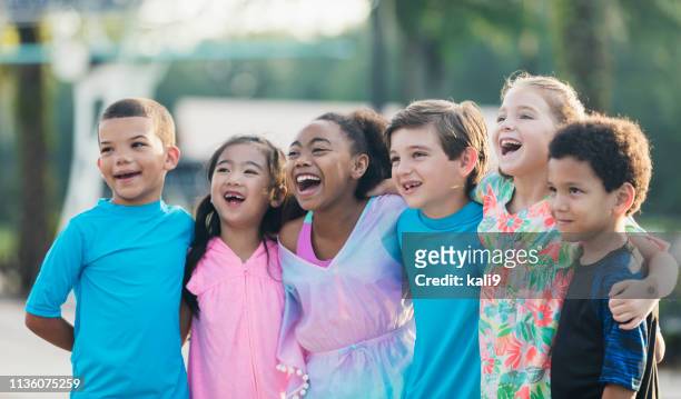 six multi-ethnic children standing at swimming pool - children only stock pictures, royalty-free photos & images