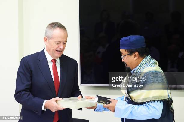 Bill Shorten is presented a gift by Mohamed Mohideen after he addressing the Islamic community at the Islamic Council of Victoria on March 16, 2019....
