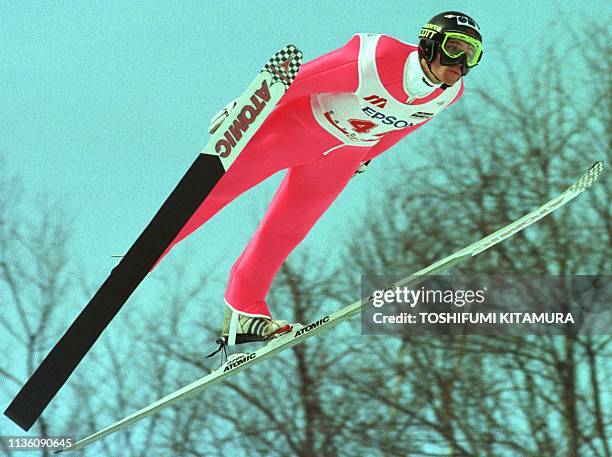 Andreas Widhoelzl of Austria is airborne for his first 134-meter jump during the World Cup Ski Jumping in Sapporo 05 February. Widhoelzl won the...