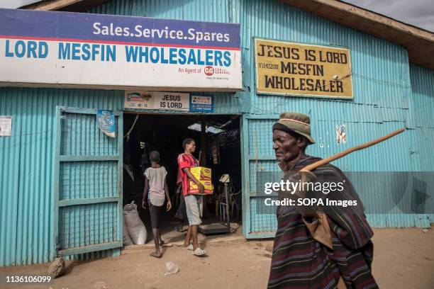 Man seen walking by a wholesale place in Kakuma refugee camp, northwest Kenya. Kakuma is home to members of the local Turkana community and the...