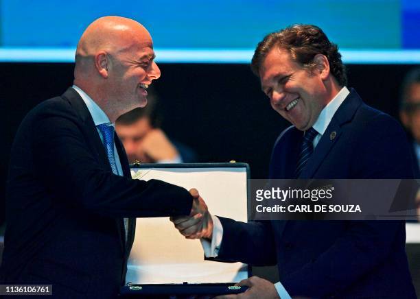 President Gianni Infantino and the President of the South American Football Confederation Alejandro Dominguez greet each other during the 70th...