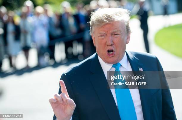 President Donald Trump speaks to the press prior to departing on Marine One from the South Lawn of the White House in Washington, DC, April 10 as he...