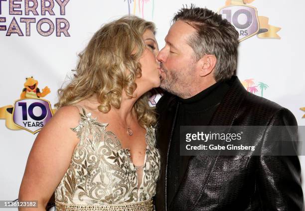 Angie Fiore Fator kisses her husband, comic ventriloquist and impressionist Terry Fator, during his 10th anniversary show at The Mirage Hotel &...
