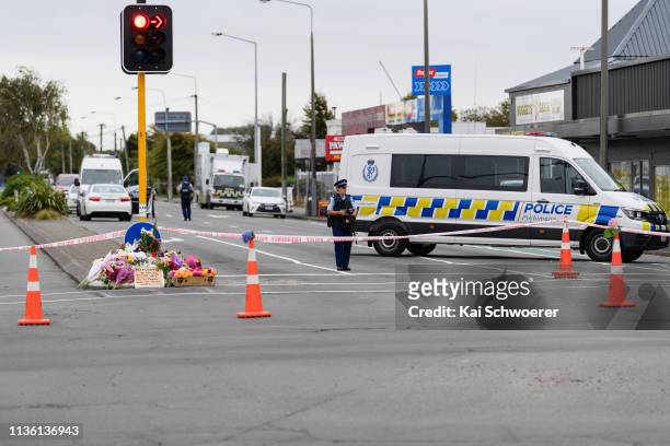 Flowers and condolences are seen in front of a police cordon on Linwood Avenue near Linwood mosque on March 16, 2019 in Christchurch, New Zealand. At...