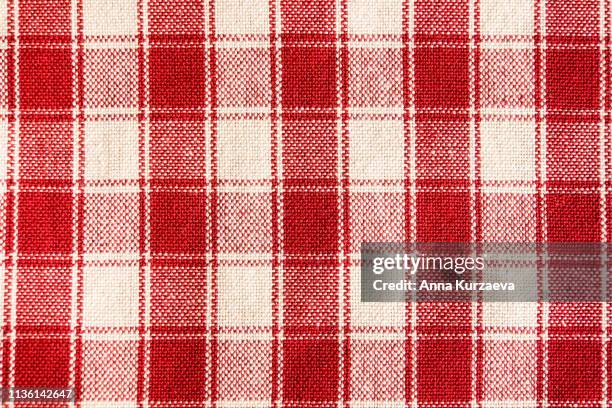 textile background with a checkered red napkin, top view. natural textile background. fabric texture background. texture of natural linen fabric. - ギンガムチェック ストックフォトと画像