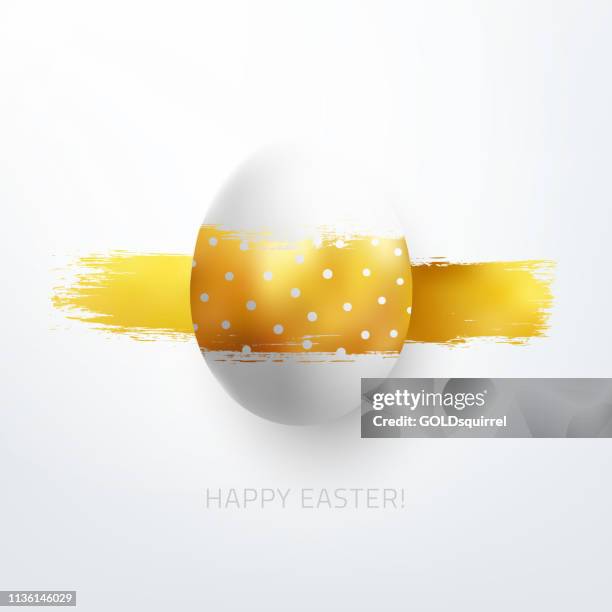 easter egg with carelessly horizontal gold painted line and small polka dot pattern - abstract artwork with realistic 3d isolated object on white paper  background with light and glowing shades of gold - easter eggs stock illustrations