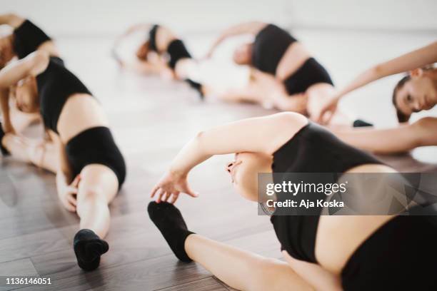 young dancer stretching. - teen girls toes stock pictures, royalty-free photos & images