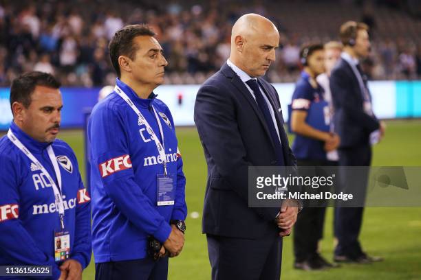 Victory head coach Kevin Muscat stands for a minutes silence in tribute to the Christchurch Mosque terror attack on March 16, 2019 in Melbourne...