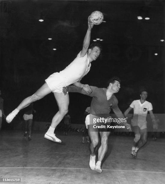 Germany takes on the Netherlands in the first game of the 4th World Handball Championships at the Berlin Sportpalast, 1st March 1961. The German team...