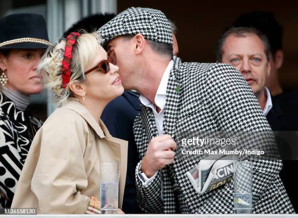 Lily Allen and Luke Evans watch the racing as they attend day 4 'Gold Cup Day' of the Cheltenham Festival at Cheltenham Racecourse on March 15, 2019...