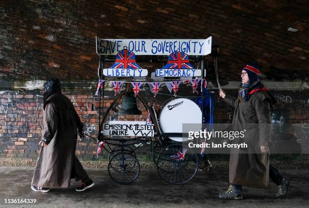 Couple push a Save Our Sovereignty trolley through a tunnel during the first leg of the March to Leave campaign on March 16, 2019 in Easington,...