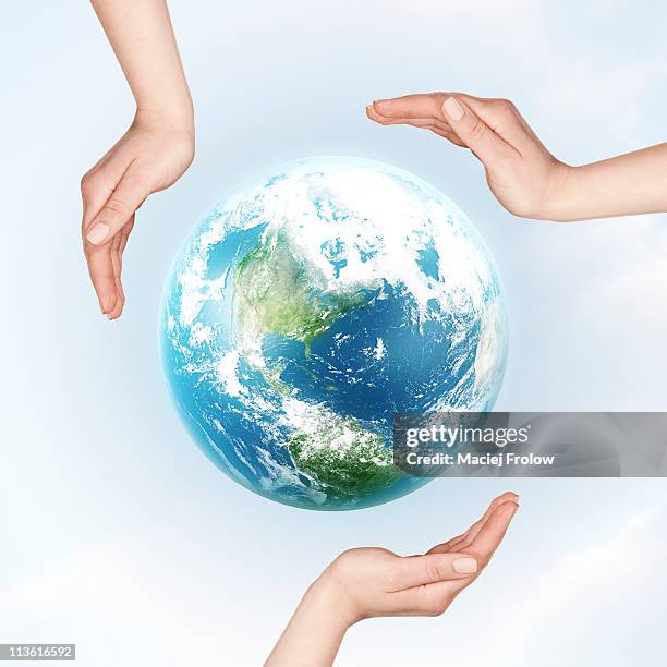 hands all over earth planet - purity stock illustrations