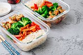 Chicken teriyaki meal prep lunch box containers with broccoli, rice and carrots