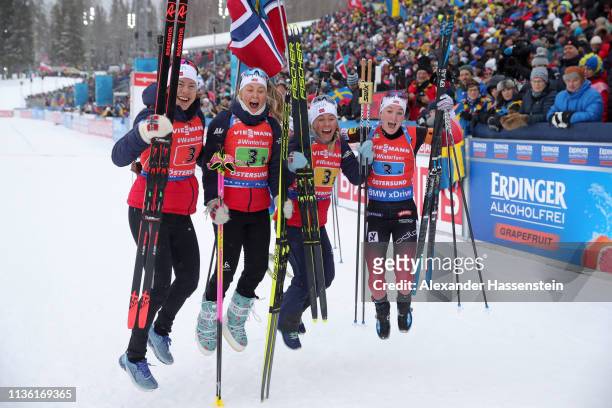 Synnoeve Solemdal, Ingrid Landmark Tandrevold, Tiril Eckhoff and Marte Olsbu Roeiseland of Norway celebrate after winning gold during the Women's...