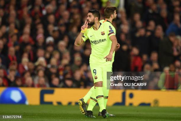 Barcelona's Uruguayan forward Luis Suarez celebrates after scoring during the UEFA Champions league first leg quarter-final football match between...