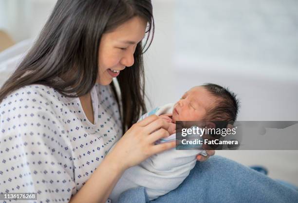 mother and baby in bed - mother newborn stock pictures, royalty-free photos & images