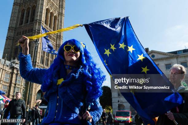 Pro-EU demonstrator holds a EU flag during a protest outside the Houses of Parliament on 10 April, 2019 in London, England. Today, Prime Minister...