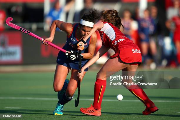 Linnea Gonzales of USA battles with Belgium's Sophie Limauge during the Women's FIH Field Hockey Pro League match between Belgium and USA at Royal...